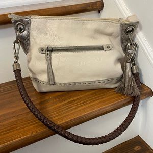 The sak cream two tone cream and gray leather shoulder bag with pewter accents